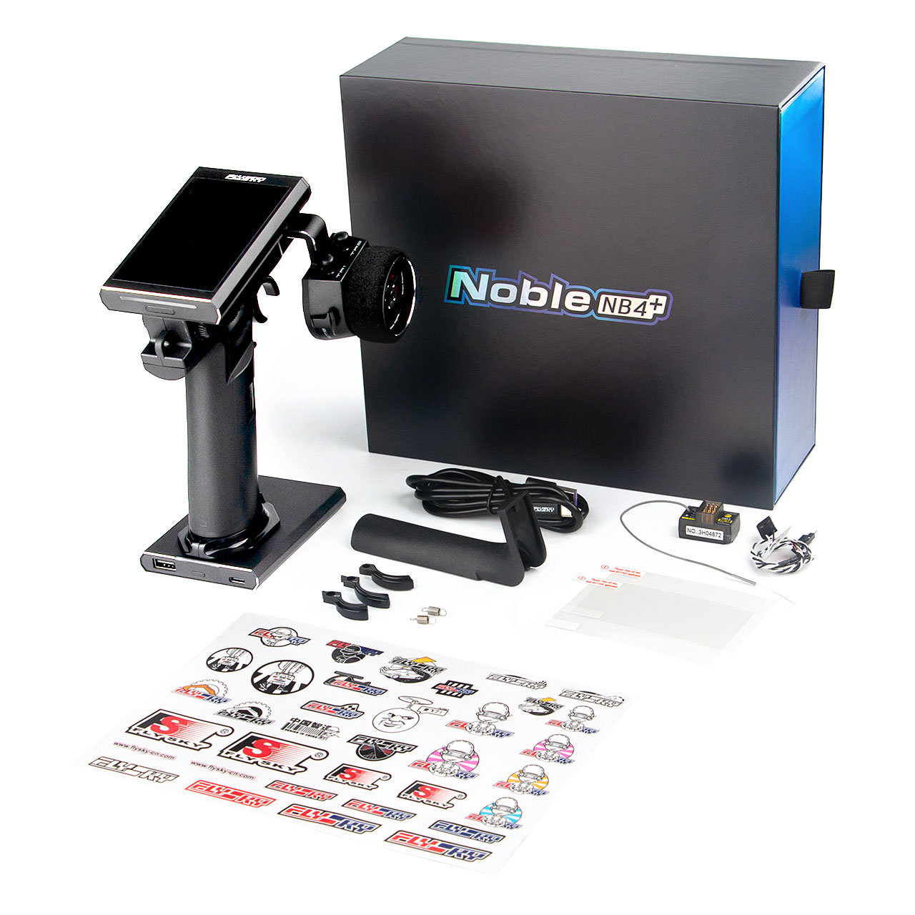 What is in the box: the Noble NB4+ transmitter in front of its retail box, a USB cable, a grip insert, a spare handwheel and cap, screws, the FS-BS4 receiver with its lead, a screen protector and a sticker sheet.